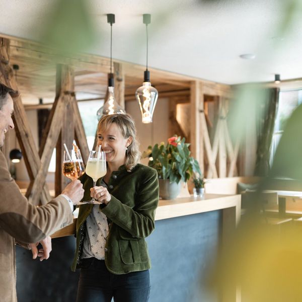 A man and a woman are having an aperitif